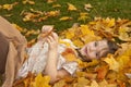 Girl Playing in Leaves