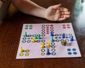 Girl playing Ludo board game. Close-up view Royalty Free Stock Photo