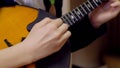 Girl playing the lute, domra close-up