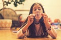 Girl playing with matches. Dangerous situation at home. A small child plays with matches, a fire, a fire flares up, danger, child Royalty Free Stock Photo