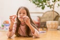 Girl playing with matches. Dangerous situation at home. A small child plays with matches, a fire, a fire flares up, danger, child Royalty Free Stock Photo