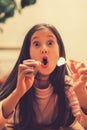 Girl playing with matches. Dangerous situation at home. A small child plays with matches, a fire, a fire flares up, danger, child Royalty Free Stock Photo