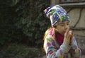 Girl playing on penny whistle