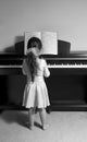 Girl playing piano Royalty Free Stock Photo