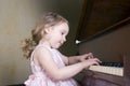 Girl playing piano Royalty Free Stock Photo