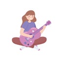 girl playing a pink guitar