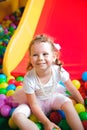 Girl playing on the playground, in the children`s maze