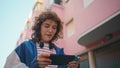 Girl playing portable console walking street closeup. Teen involved video game Royalty Free Stock Photo