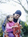 Girl Playing On Rocking Horse Royalty Free Stock Photo