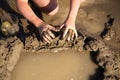 Girl playing in the sand on the lake Royalty Free Stock Photo