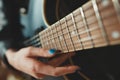 Girl playing on the semi-acoustic guitar.