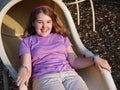 Girl playing on slide