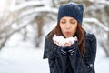 Girl playing with snow in park - close up portrait. Copy space Royalty Free Stock Photo