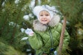Girl playing snowballs. Funny little girl having fun in winter park. making snowballs happy child girl. winter girl throwing Royalty Free Stock Photo