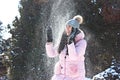 A girl playing snowballs in winter in parck Royalty Free Stock Photo