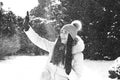 A girl playing snowballs in winter in parck Royalty Free Stock Photo
