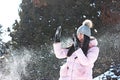 A girl playing snowballs in winter in parck Royalty Free Stock Photo