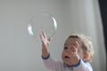 Girl playing with soap bubbles Royalty Free Stock Photo