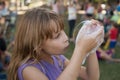 Girl playing with soap bubbles Royalty Free Stock Photo