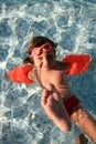 Girl playing in swimming pool Royalty Free Stock Photo