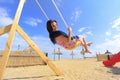 Girl playing on a swing-set Royalty Free Stock Photo