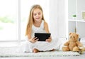 Girl playing tablet computer