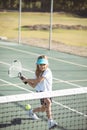 Girl playing tennis on court Royalty Free Stock Photo