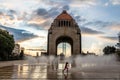 Girl playing with the water fountain in front of Monument to the Mexican Revolution - Mexico City, Mexico