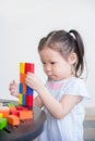 Girl playing wood blocks Royalty Free Stock Photo