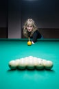 The girl plays billiards Royalty Free Stock Photo