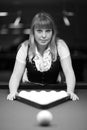 Girl plays billiards Royalty Free Stock Photo