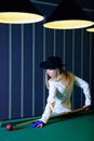 The girl plays billiards Royalty Free Stock Photo