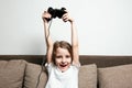 Girl plays on the console Royalty Free Stock Photo