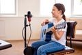girl plays on guitar, adorable kid in casual wear learning to play musical instrument Royalty Free Stock Photo