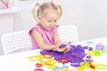 Girl plays kinetic sand in quarantine.