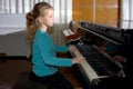 The girl plays piano, close up , white and black keyboard Royalty Free Stock Photo