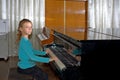 The girl plays piano, close up , white and black keyboard Royalty Free Stock Photo