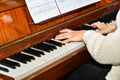 The girl plays the piano in the concert hall at the performance Royalty Free Stock Photo