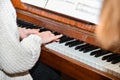 The girl plays the piano in the concert hall at the performance Royalty Free Stock Photo