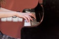 Girl plays piano Royalty Free Stock Photo