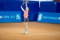 Girl plays tennis on the field