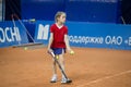 Girl plays tennis on the field