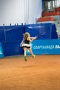 Girl plays tennis on the field