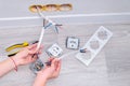 The girl plugs the cable into an outlet. Repair in the house. Royalty Free Stock Photo