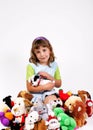 Girl and plushy toys Royalty Free Stock Photo