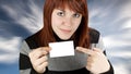 Girl pointing at a blank business card