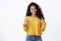 Girl pointing herself as bragging own achievement. Successful smiling happy african-american woman with curly hair Royalty Free Stock Photo