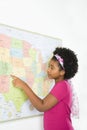 Girl pointing on map.