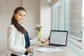 Girl pointing on notebook monitor. Businesswoman showing on laptop screen Royalty Free Stock Photo