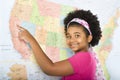 Girl pointing to map.